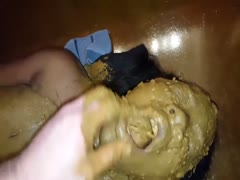 Wet brown shit of a guy covers a bitch's cute face